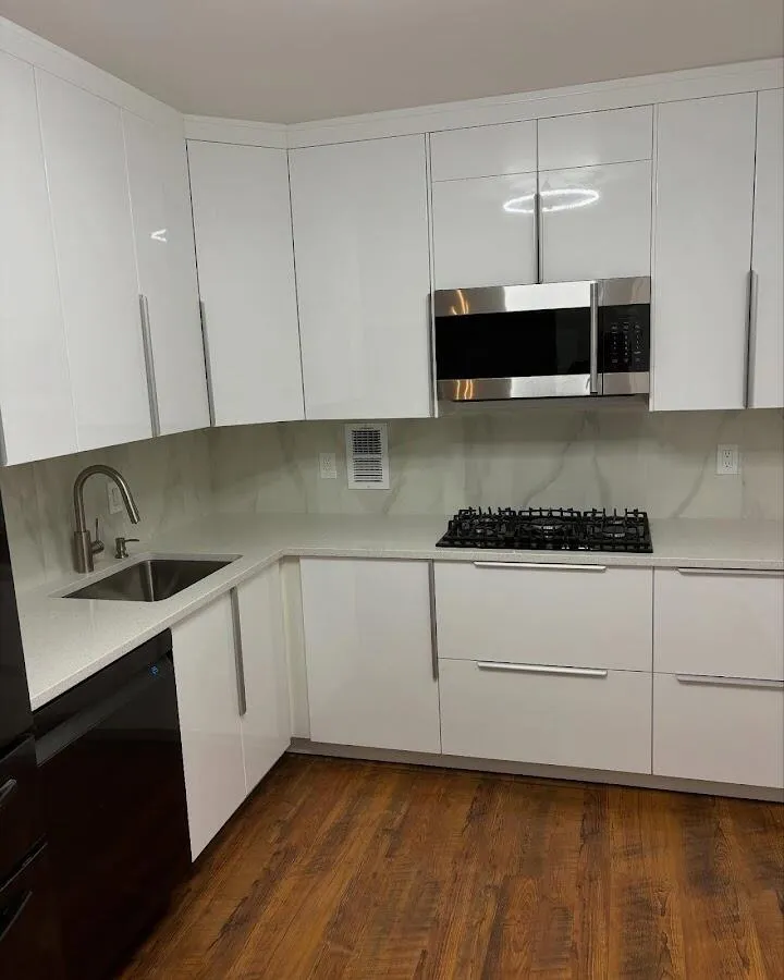 Restored kitchen with white cabinets after water damage in Gateway